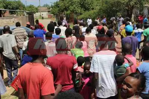 Zimbabwean Pastor Publicly Beaten & Humiliated For Impregnating His Follower (Photos)